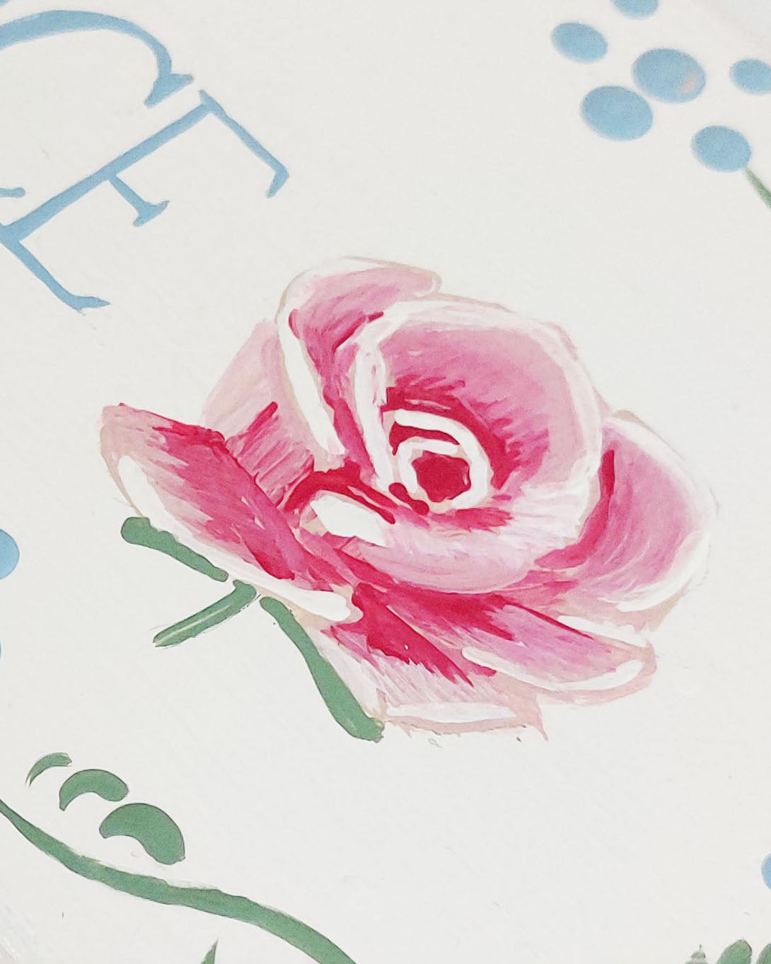 Nursery door sign personalised with the name 'Florence', featuring beautiful roses and a decorative blue floral border, perfect for baby room decor.