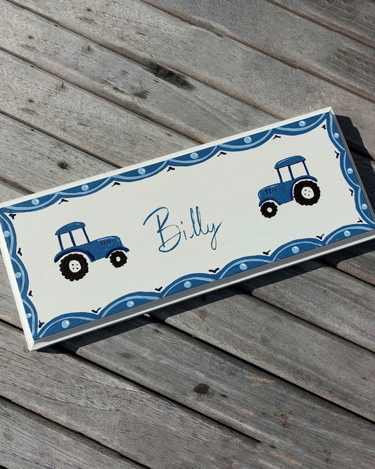 Nursery door sign personalised with the name 'Billy', featuring farmyard tractors and a decorative blue scalloped border, perfect for baby room decor.