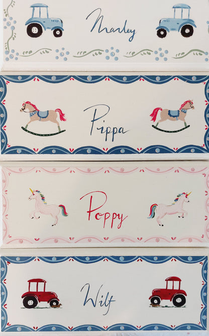 A collection of Nursery door sign personalised with different names and decorations. Perfect for baby room decor.