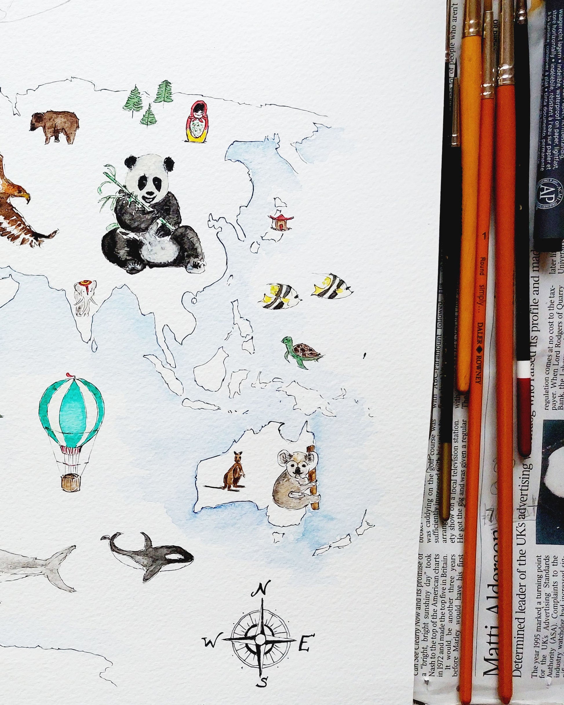 Personalised world map print with wildlife illustrations, educational nursery wall art.