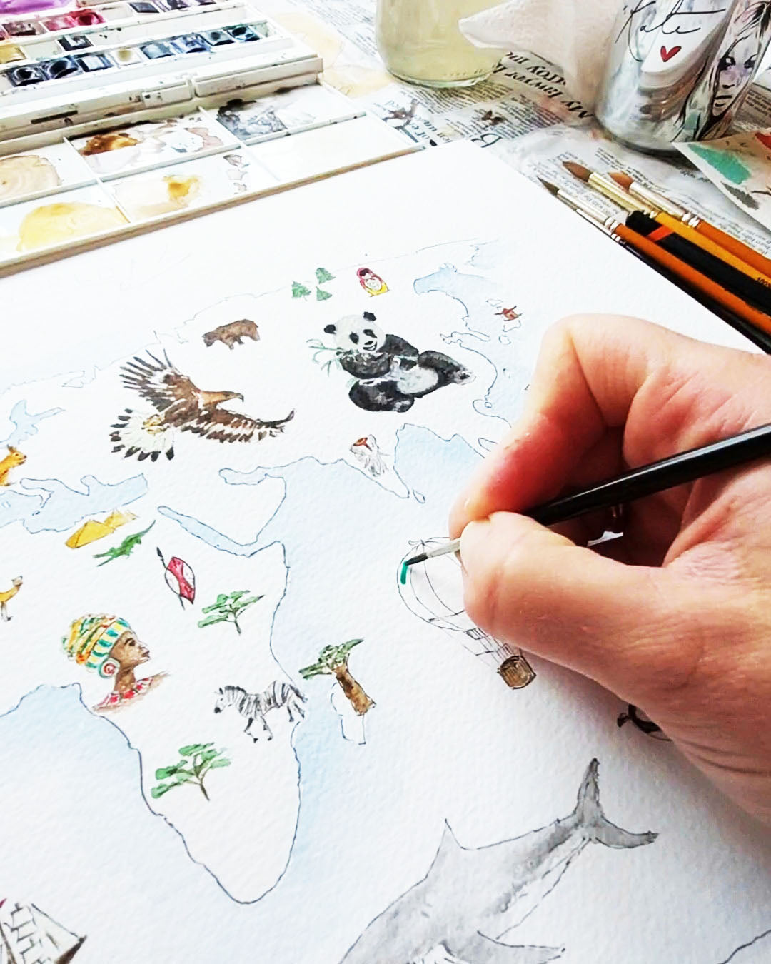 Personalised world map print with wildlife illustrations, educational nursery wall art.