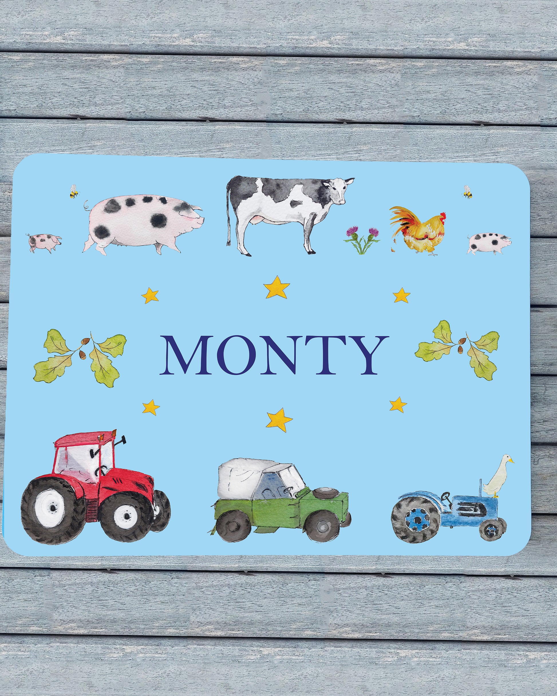 Hand-painted watercolour melamine placemat featuring various farm animals and vehicles, cork-backed and heat-resistant, ideal for kids' meals, made in the UK.