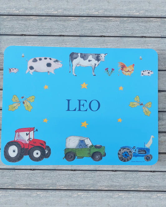 Hand-painted watercolour melamine placemat featuring various farm animals and vehicles, cork-backed and heat-resistant, ideal for kids' meals, made in the UK.