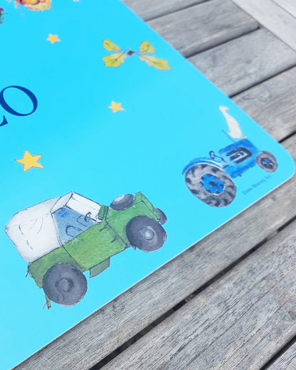 Hand-painted watercolour melamine placemat featuring various farm animals and vehicles, cork-backed and heat-resistant, ideal for kids' meals, made in the UK.